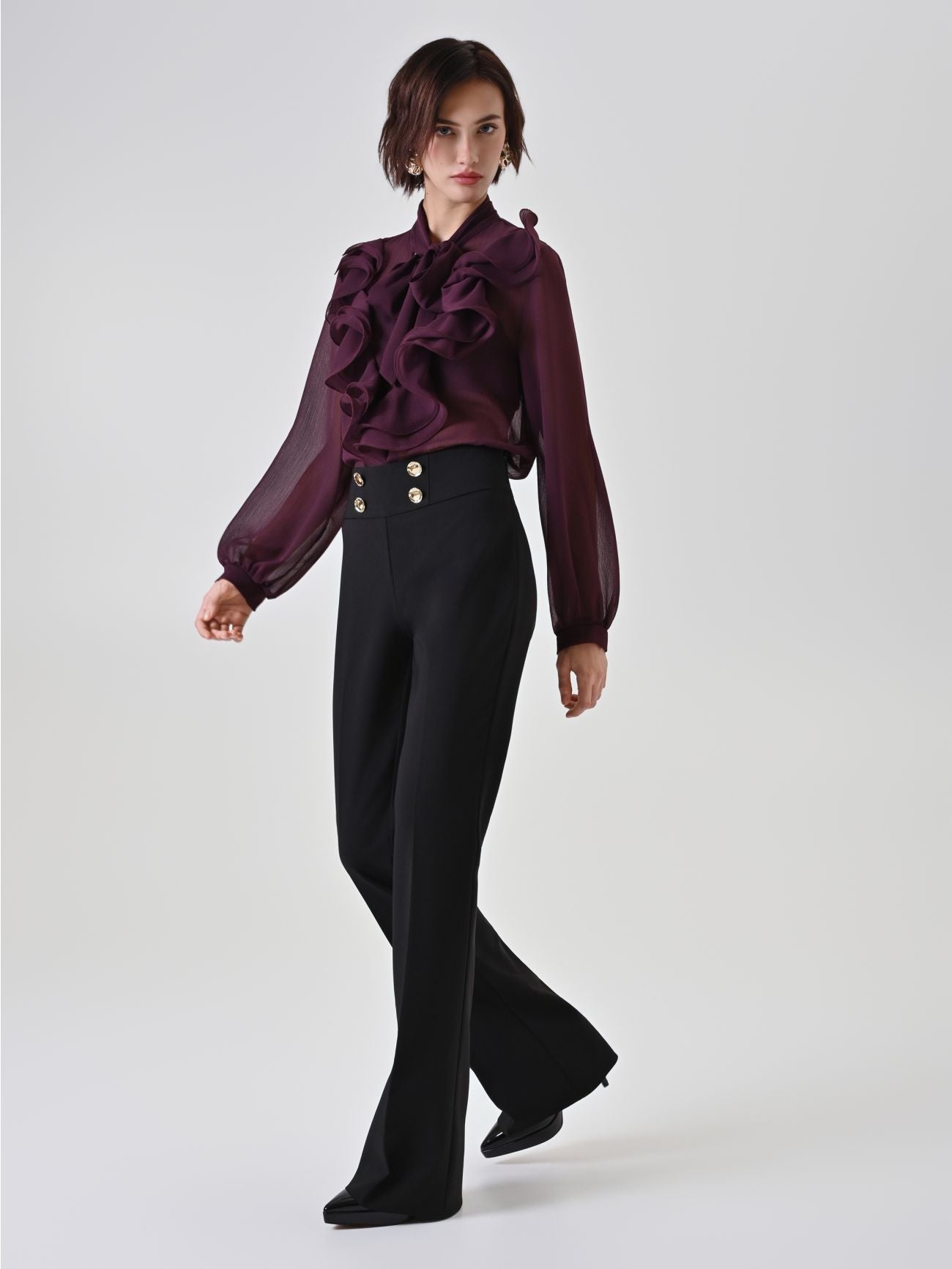 Rinascimento zwarte flared broek met gouden knopen